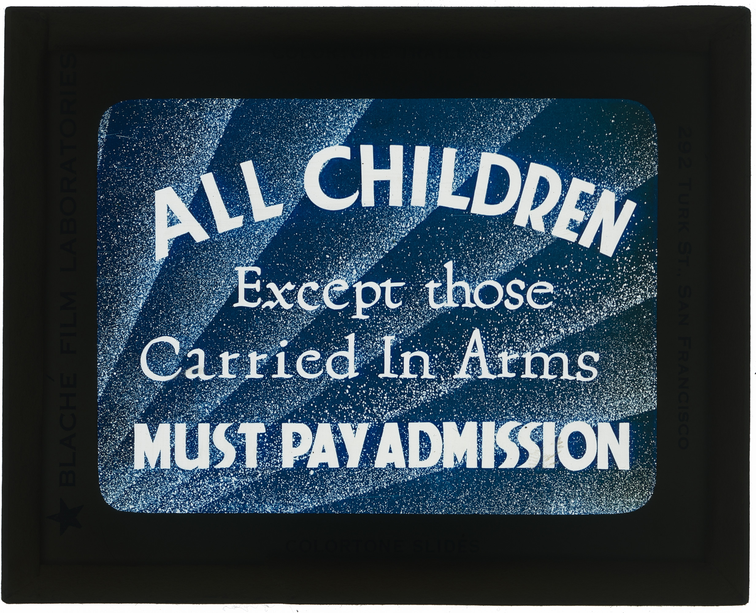 Image of backlit lantern slide with blue emulsion and white lettering.